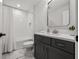 Modern bathroom featuring a shower-tub, vanity with sleek countertop, and stylish fixtures at 8932 Isabella Cir, Parrish, FL 34219