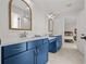 Bathroom with dual vanities and doorway leading to bedroom at 8932 Isabella Cir, Parrish, FL 34219