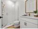 Stylish bathroom with modern fixtures, features tiled shower, vanity, and sleek glass door enclosure at 8932 Isabella Cir, Parrish, FL 34219