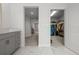 Bathroom with double vanity and adjacent walk-in closet and hallway at 8932 Isabella Cir, Parrish, FL 34219