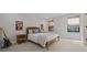 Bedroom with a light-colored walls, wood accents, and two windows with bamboo blinds at 8932 Isabella Cir, Parrish, FL 34219