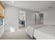 Bedroom with a bed and doorway to bathroom at 8932 Isabella Cir, Parrish, FL 34219