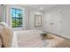 Cozy bedroom with natural light, plush carpeting, and convenient closet at 8932 Isabella Cir, Parrish, FL 34219