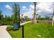 Bike park rules displayed, showcasing landscaping, lush grass, and view of the pump track in the background at 8932 Isabella Cir, Parrish, FL 34219