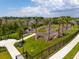 View of the community bike park with a pump track, palms, lush greenery, and adjacent walking paths at 8932 Isabella Cir, Parrish, FL 34219