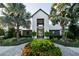 Exterior of the community center with lush landscaping, paved walkway and palm trees at 8932 Isabella Cir, Parrish, FL 34219