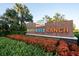 A lush community sign for North River Ranch with colorful landscaping welcomes residents and visitors at 8932 Isabella Cir, Parrish, FL 34219