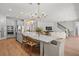 Open kitchen design with an island, ample seating, and views of the living area, perfect for entertaining at 8932 Isabella Cir, Parrish, FL 34219