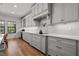 Bright kitchen features custom cabinets, subway tile backsplash, and modern appliances at 8932 Isabella Cir, Parrish, FL 34219
