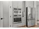 Kitchen features stainless steel appliances, including built-in oven and refrigerator at 8932 Isabella Cir, Parrish, FL 34219