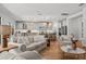 Bright, open-concept living room showcasing an eat-in kitchen and staircase at 8932 Isabella Cir, Parrish, FL 34219