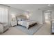 Spacious main bedroom showcasing a plush bed, elegant decor, and serene lighting at 8932 Isabella Cir, Parrish, FL 34219