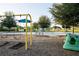 Community playground with swings, climbing structure, and seating areas for residents to enjoy at 8932 Isabella Cir, Parrish, FL 34219