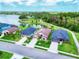Aerial view of a lakefront community showcasing homes with lush landscaping and scenic walking paths at 9229 52Nd E Ave, Palmetto, FL 34221