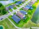 Aerial view of a residential neighborhood with houses, streets, and a scenic lake at 9229 52Nd E Ave, Palmetto, FL 34221
