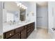 Bathroom featuring a vanity with double sinks and a large mirror at 9229 52Nd E Ave, Palmetto, FL 34221