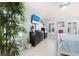 Bedroom featuring light blue walls and views to the exterior through plantation shutters at 9229 52Nd E Ave, Palmetto, FL 34221