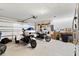 Spacious garage featuring two motorcycles and ample storage space at 9229 52Nd E Ave, Palmetto, FL 34221