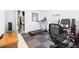 Home gym with rubber mat flooring and featuring a treadmill and stationary bike at 9229 52Nd E Ave, Palmetto, FL 34221