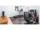 Home gym with rubber mat flooring and featuring a treadmill and stationary bike at 9229 52Nd E Ave, Palmetto, FL 34221