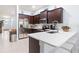 Bright kitchen featuring stainless steel appliances, dark wood cabinets and ample counter space at 9229 52Nd E Ave, Palmetto, FL 34221