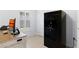 Office featuring a large gun safe, desk, and plantation shutters on the window at 9229 52Nd E Ave, Palmetto, FL 34221