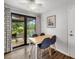 Cozy dining area with sliding glass doors to the patio and plenty of natural light at 928 Pineland Ave, Venice, FL 34285