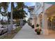 Street view of downtown with shops, sidewalks, and palm trees enhancing the community's atmosphere at 928 Pineland Ave, Venice, FL 34285