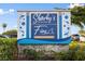 Sharky's On the Pier and Fins at Venice Fishing Pier sign with lush vegetation and blue skies at 928 Pineland Ave, Venice, FL 34285