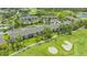 Aerial view of the condo community, showcasing the golf course and serene ponds at 9540 High Gate Dr # 1422, Sarasota, FL 34238