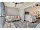 Cozy screened balcony with seating area and direct access to the living room at 9540 High Gate Dr # 1422, Sarasota, FL 34238