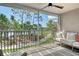 Relaxing screened balcony with seating, overlooking the lake and golf course at 9540 High Gate Dr # 1422, Sarasota, FL 34238