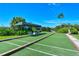 Bocce ball court featuring lush landscaping and shaded benches, ideal for social gatherings and friendly competition at 9540 High Gate Dr # 1422, Sarasota, FL 34238
