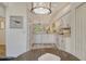 Bright, white kitchen with stainless appliances, granite countertops, and an open view to the dining area at 9540 High Gate Dr # 1422, Sarasota, FL 34238