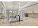 Bright kitchen with stainless steel appliances, granite countertops, and an eat-in kitchen table with access to the lanai at 9540 High Gate Dr # 1422, Sarasota, FL 34238