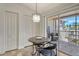 Enclosed lanai with a dining set, providing an inviting outdoor retreat with seamless access to the kitchen at 9540 High Gate Dr # 1422, Sarasota, FL 34238