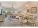 Bright living room with tile flooring, stylish furnishings, and a serene view at 9540 High Gate Dr # 1422, Sarasota, FL 34238