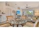 Open living area with tile floors, vaulted ceilings, and sun-filled natural light at 9540 High Gate Dr # 1422, Sarasota, FL 34238