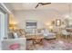 Comfortable living room showcasing plush seating, stylish rug, and vaulted ceilings providing an inviting space at 9540 High Gate Dr # 1422, Sarasota, FL 34238