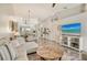 Spacious living room, seamlessly connecting the dining, kitchen, and outdoor balcony at 9540 High Gate Dr # 1422, Sarasota, FL 34238