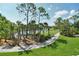 Scenic view of the golf course and lush trees from a screened in lanai at 9540 High Gate Dr # 1422, Sarasota, FL 34238