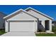 Charming single-story home with a two-car garage and well-maintained lawn at 10713 Hidden Banks Gln, Parrish, FL 34219