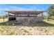 Rural horse barn with wood construction, providing a shelter and offering an equestrian haven, complete with stables at 12714 Tyler Run Ave, Odessa, FL 33556