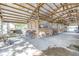 Spacious interior featuring stalls, seating, and equipment, ideal for taking care of horses or other livestock at 12714 Tyler Run Ave, Odessa, FL 33556