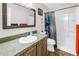Traditional bathroom with a tub, shower, and vanity with a sink, and a dark framed mirror on the wall at 12714 Tyler Run Ave, Odessa, FL 33556