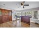 Bright entryway with wooden door, large windows, and a charming horse decoration at 12714 Tyler Run Ave, Odessa, FL 33556