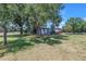 Rear exterior showing private yard, wooded area and country feel at 12714 Tyler Run Ave, Odessa, FL 33556