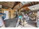 Spacious garage interior filled with tools, bicycles, and equipment, offering ample workspace and storage solutions at 12714 Tyler Run Ave, Odessa, FL 33556