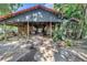 Charming horse barn with multiple stalls, wooden accents, and ample space for animals and equipment at 12714 Tyler Run Ave, Odessa, FL 33556