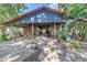 Well-maintained horse stables featuring multiple stalls and ample shade at 12714 Tyler Run Ave, Odessa, FL 33556